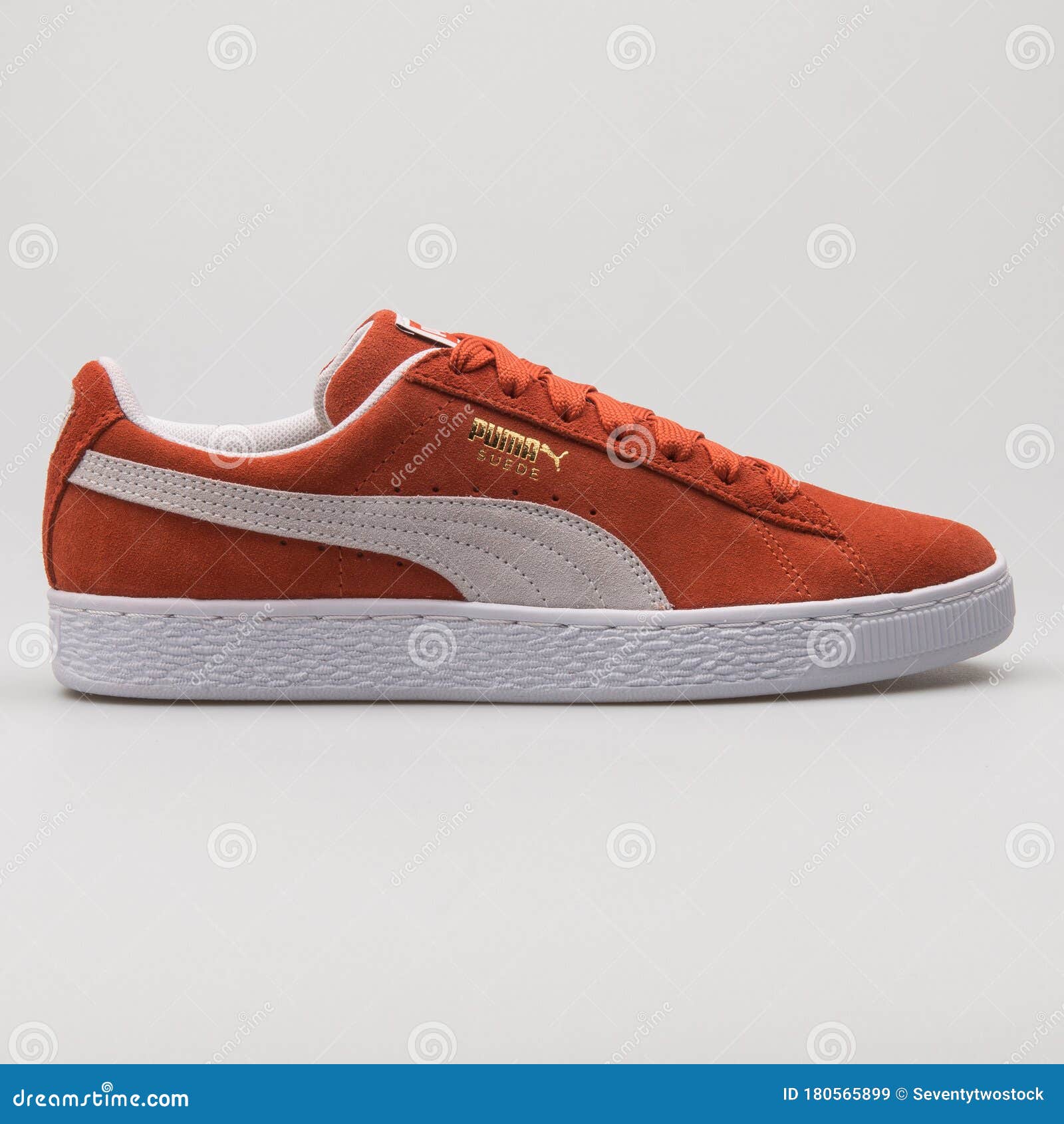 orange pumas suede