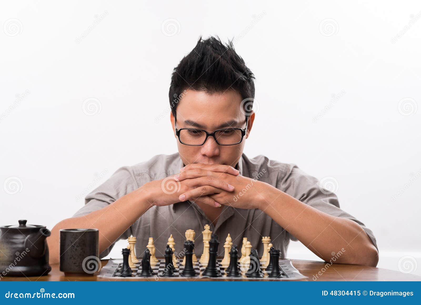 man studying the next chess move Stock Photo - Alamy