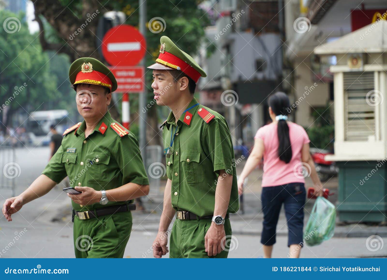 Vietnamese Police Wearing Green Uniforms. Editorial Stock Image - Image