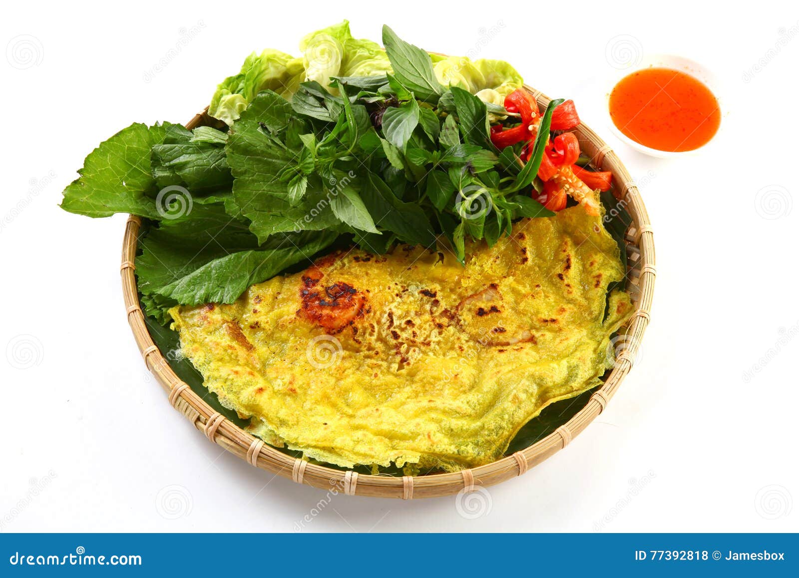 vietnamese rice pancake or banh xeo with herbs and chili sauce o