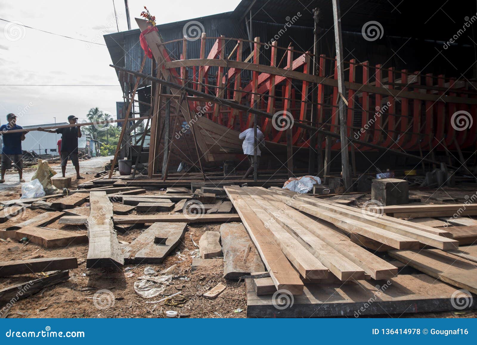 Vietnamese Workers Build A Large Wooden Boat In Nga Bay In ...