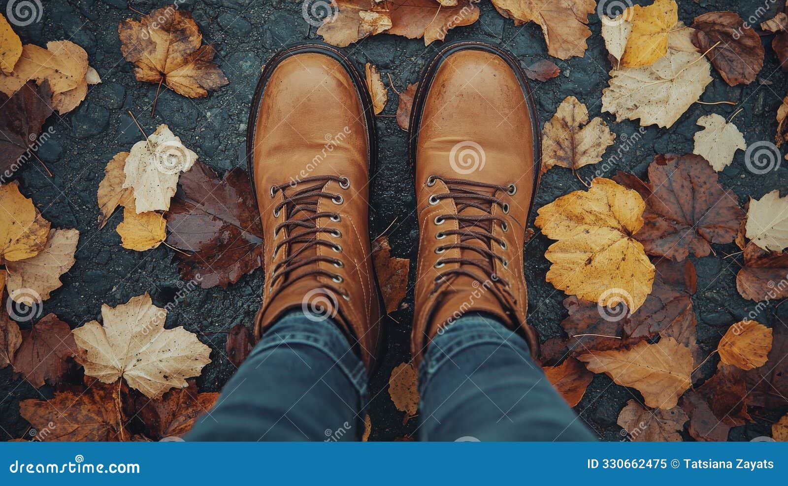 view from above of boots walking on an autumn path. fall season, first person perspective, pov image