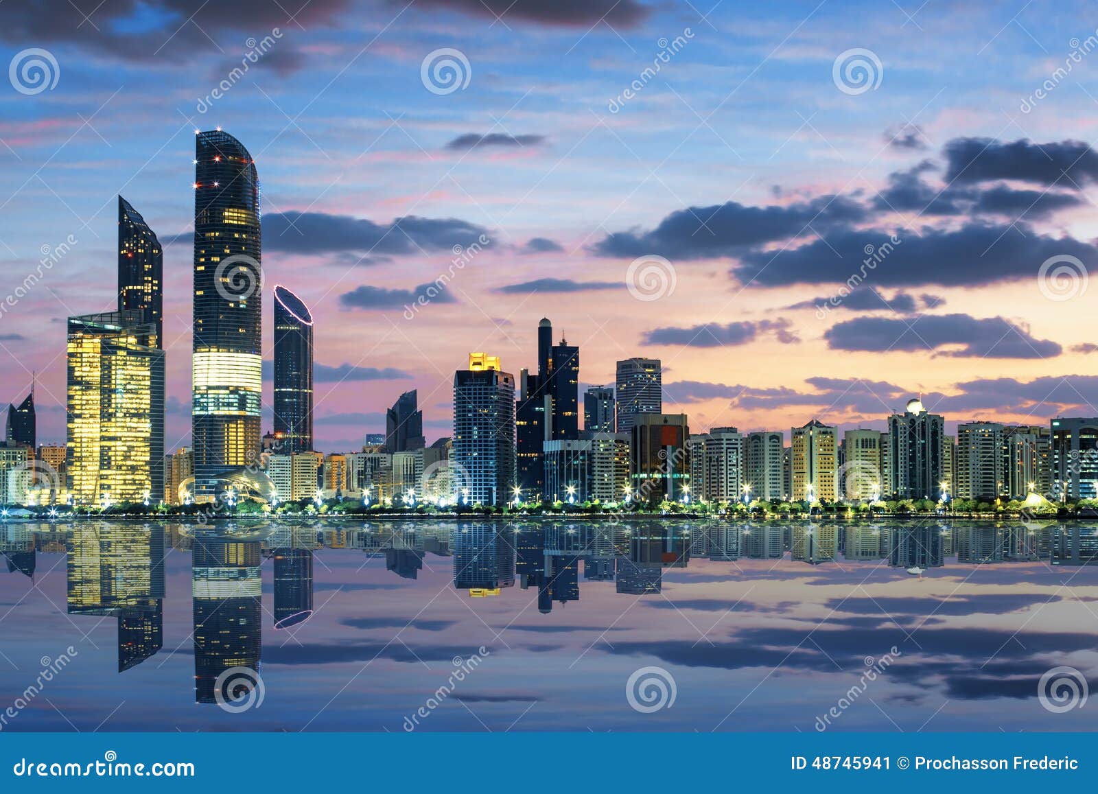 view of abu dhabi skyline at sunset