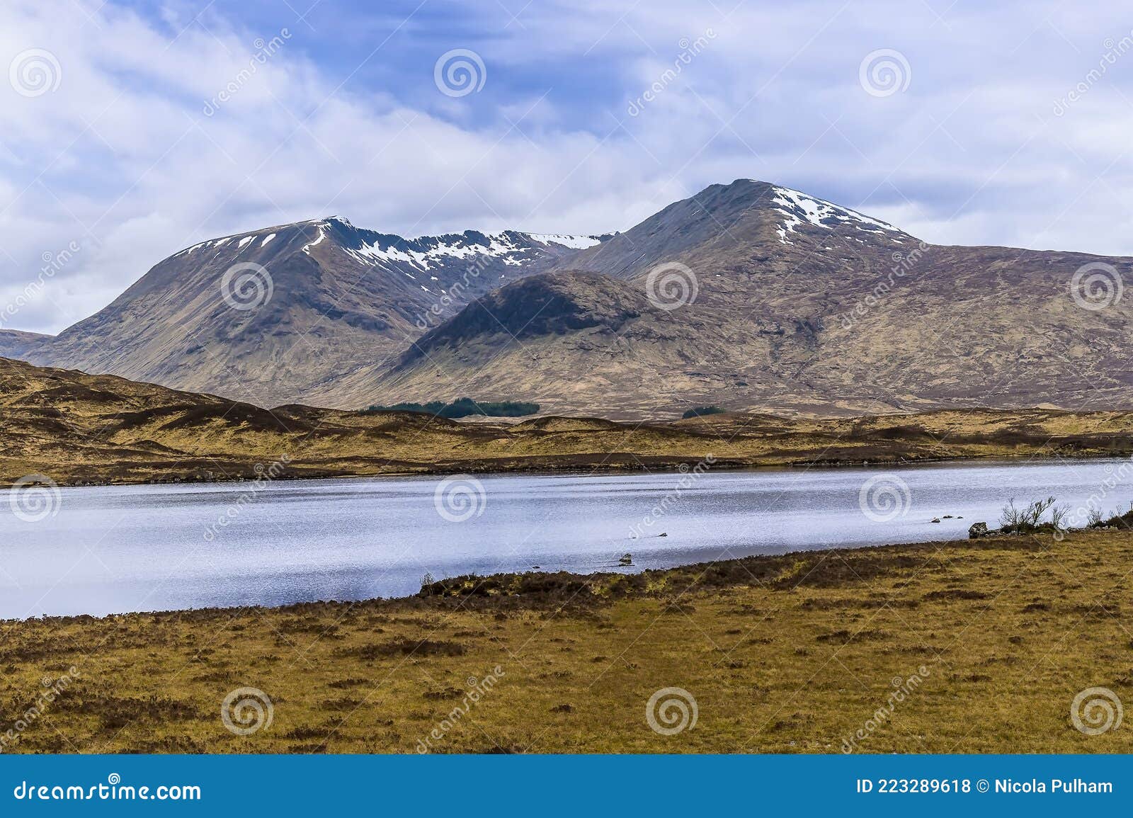 a view across the loch of the armpit towards an ice age corrie near glencoe, scotland
