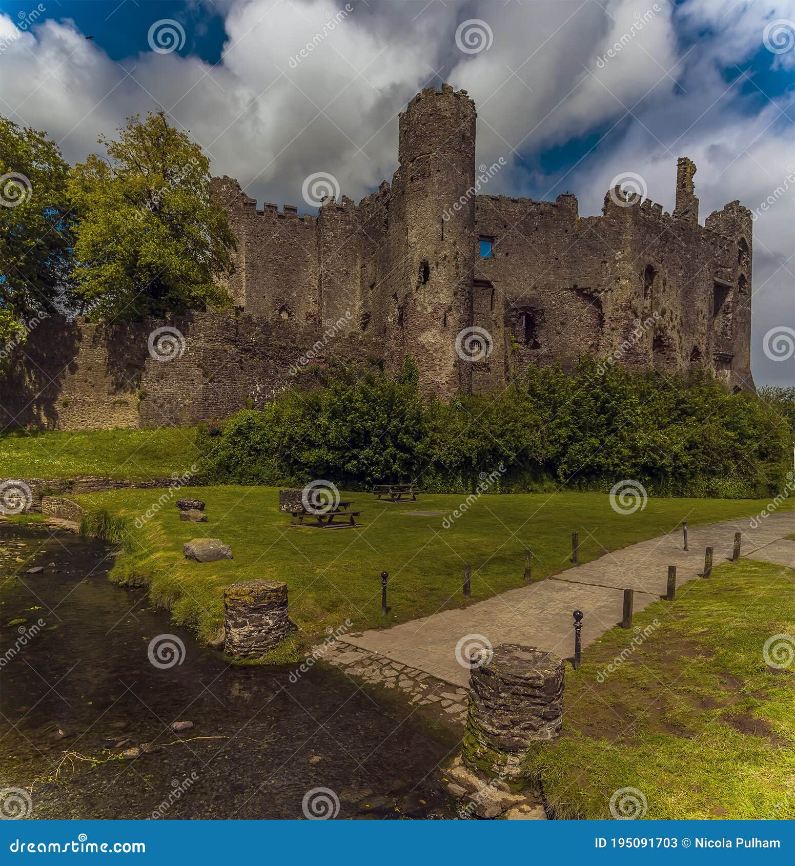 a view across the river coran towards the castle at laugharne, wales