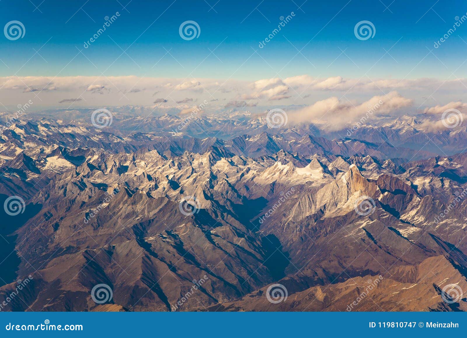 view from the aircraft to the mountains of the himalaya on chine