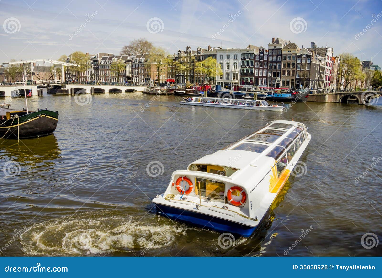 view on amsterdam and amstel rive with cruise boats , the nether