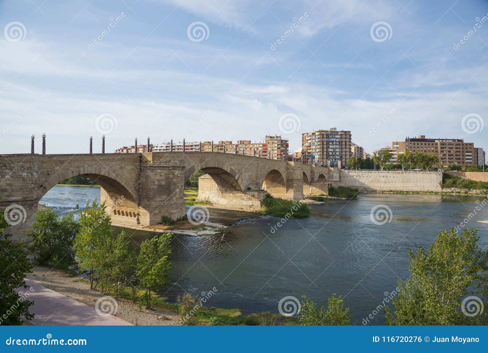 stone bridge and ebro river in zaragoza, spain