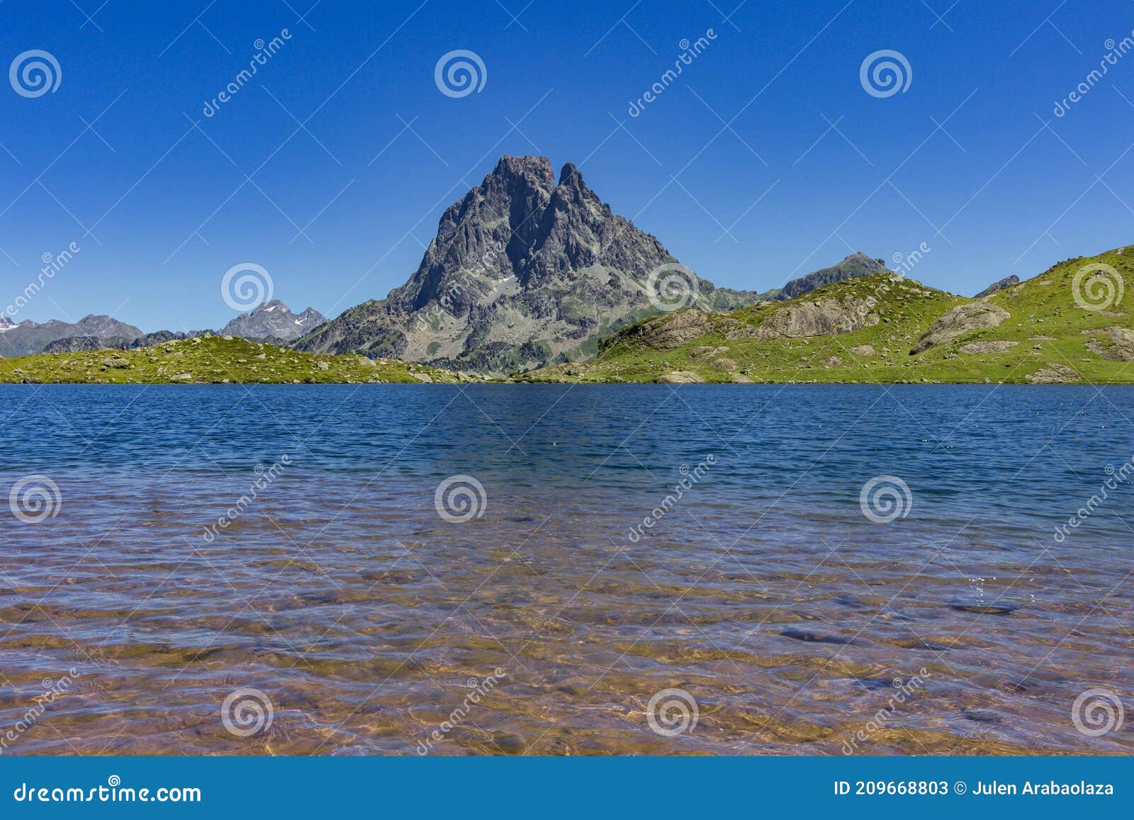 view of ayous lakes and midi d`ossau mountain in the pyrenees france