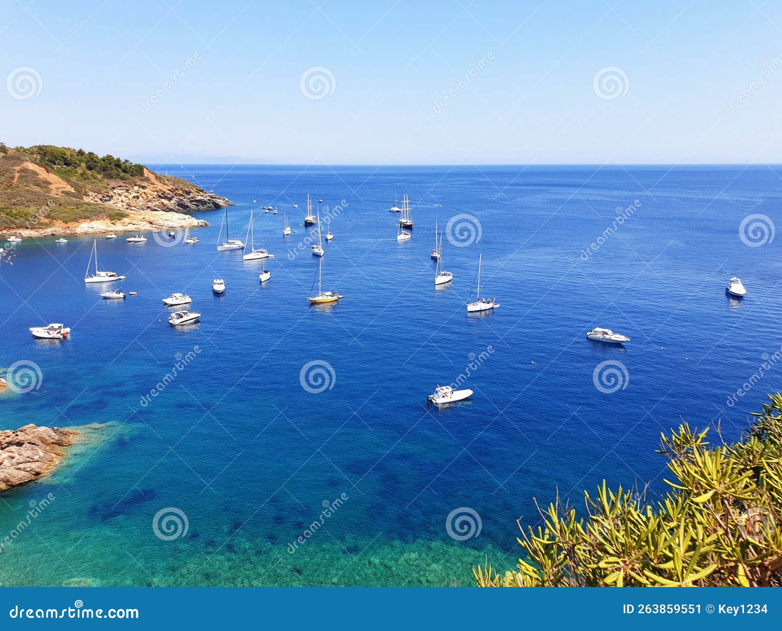 view of the azure sea and boats near barbarossa beach