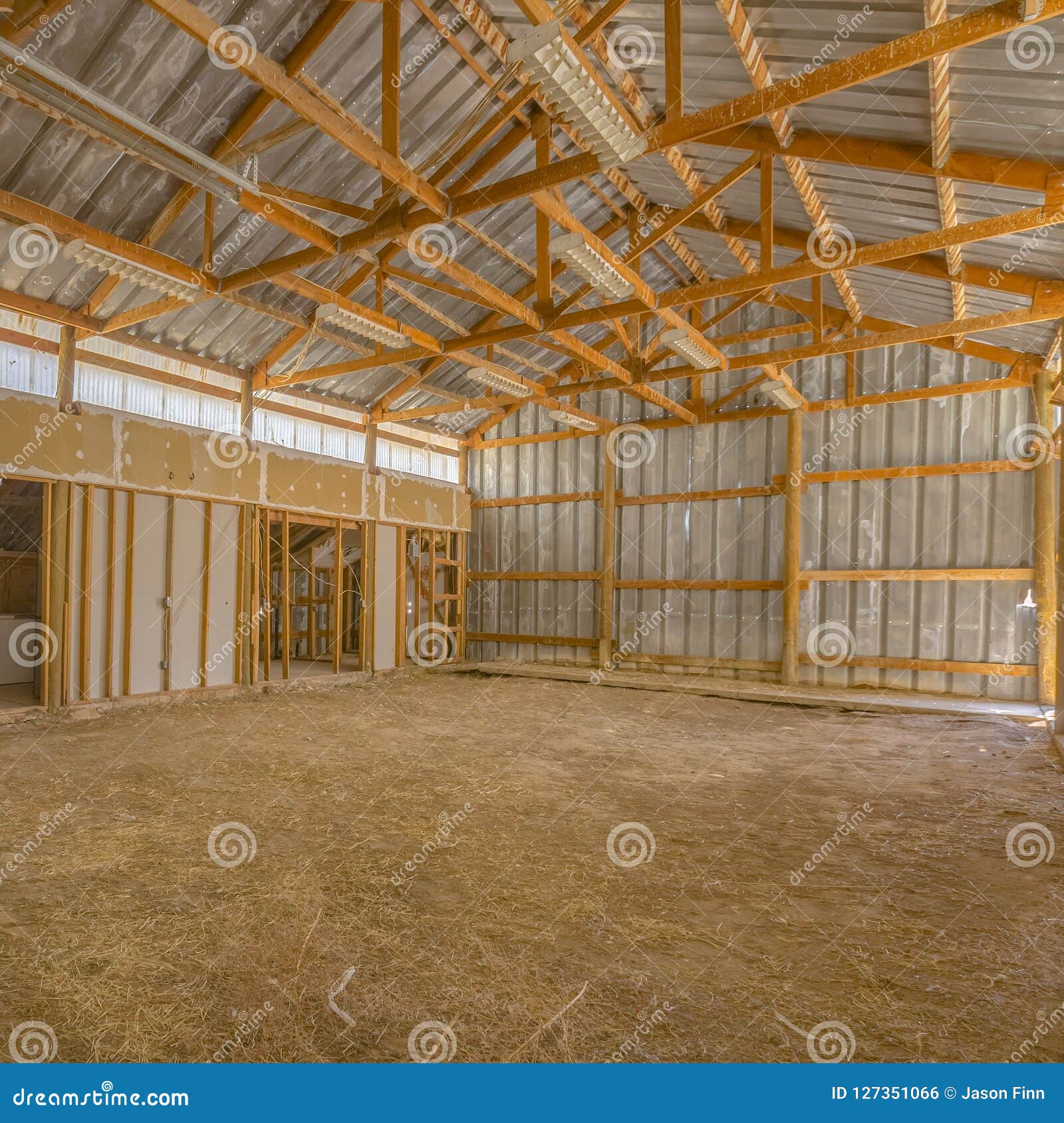 View Of A Barn Interior With Metal Roof And Wall Stock Photo