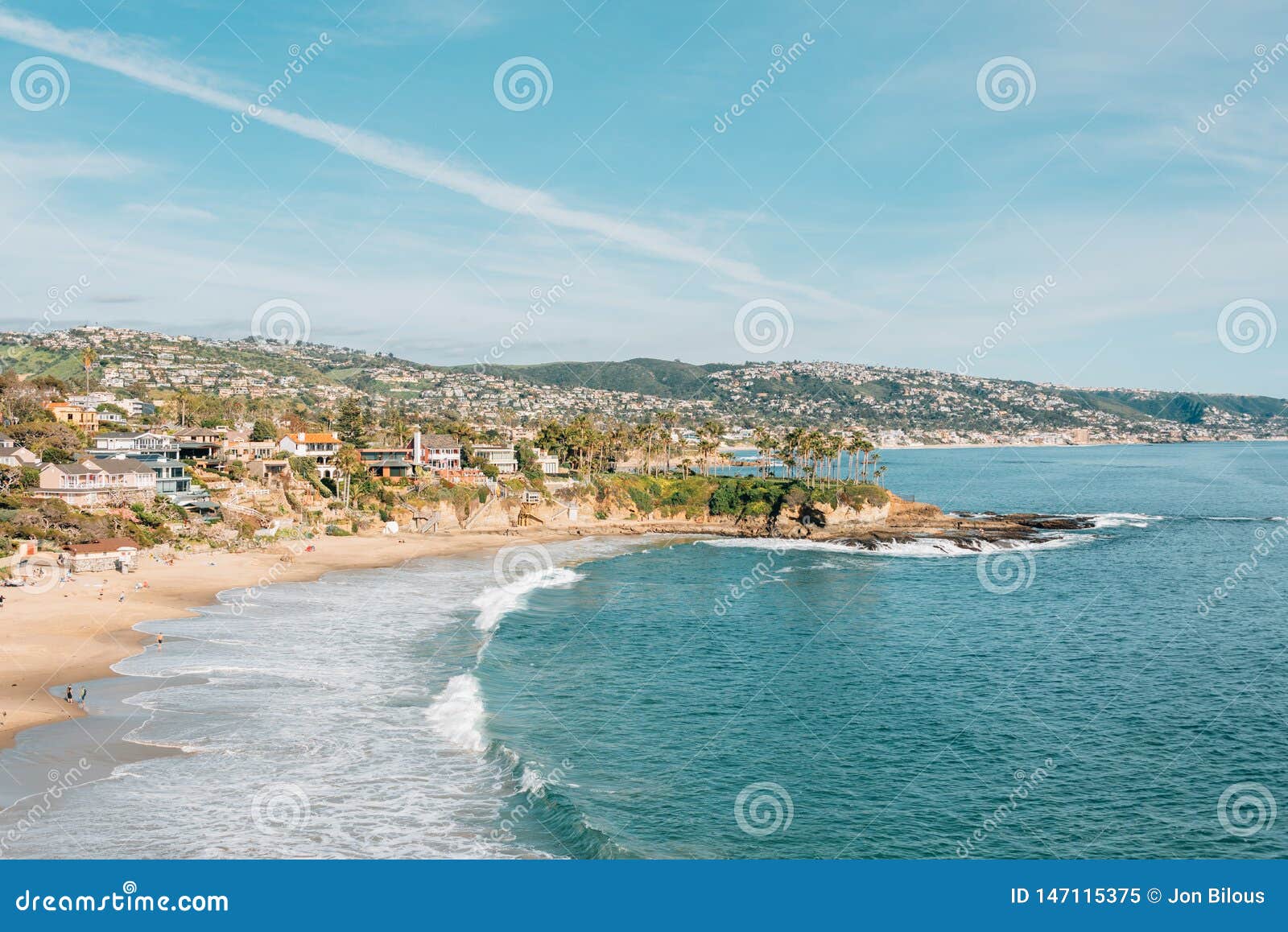view of beach and cliffs at crescent bay, from crescent bay point park, in laguna beach, california