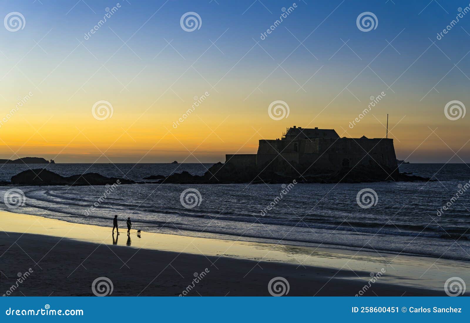 view of the beach du sillon at sunset.