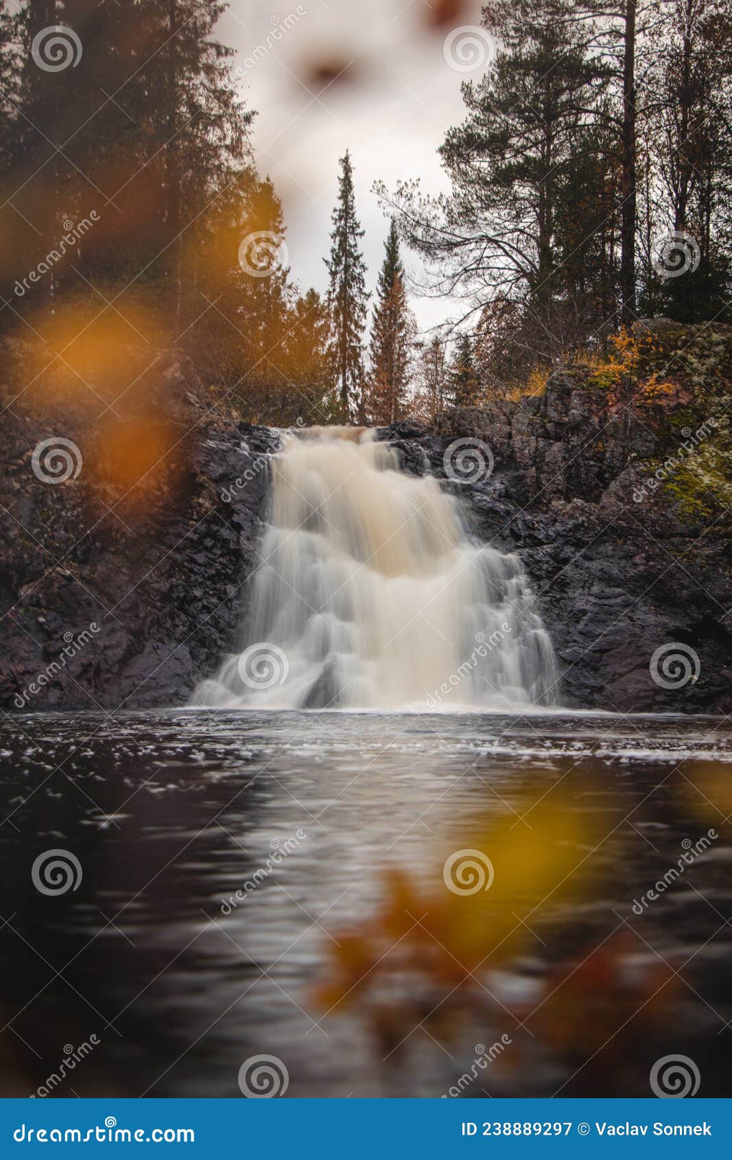 view of the beautiful komulankÃÂ¶ngÃÂ¤s waterfall, located in the northern part of kainuu, finland. view through the colourful