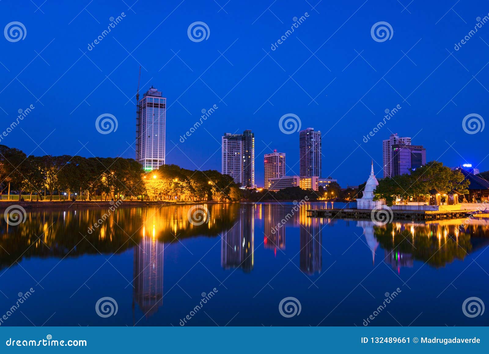 view of beira lake in colombo, sri lanka with buddhist temple