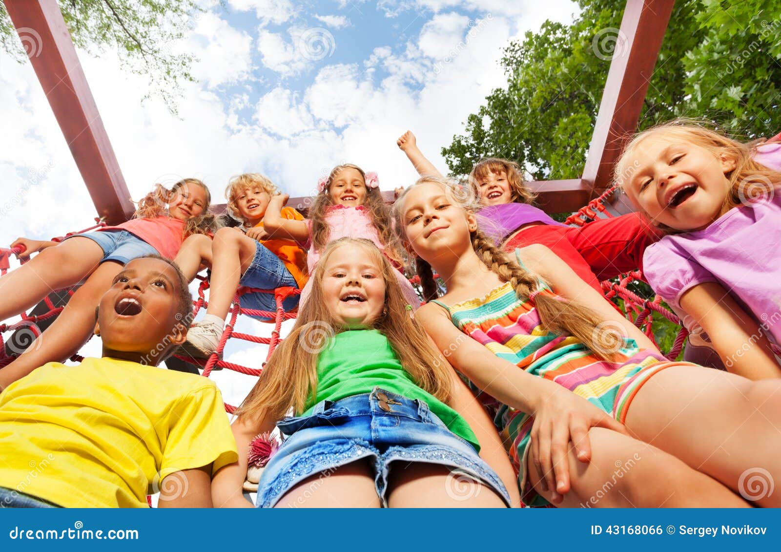 View from Below of Happy Kids on Net Ropes Stock Photo - Image of