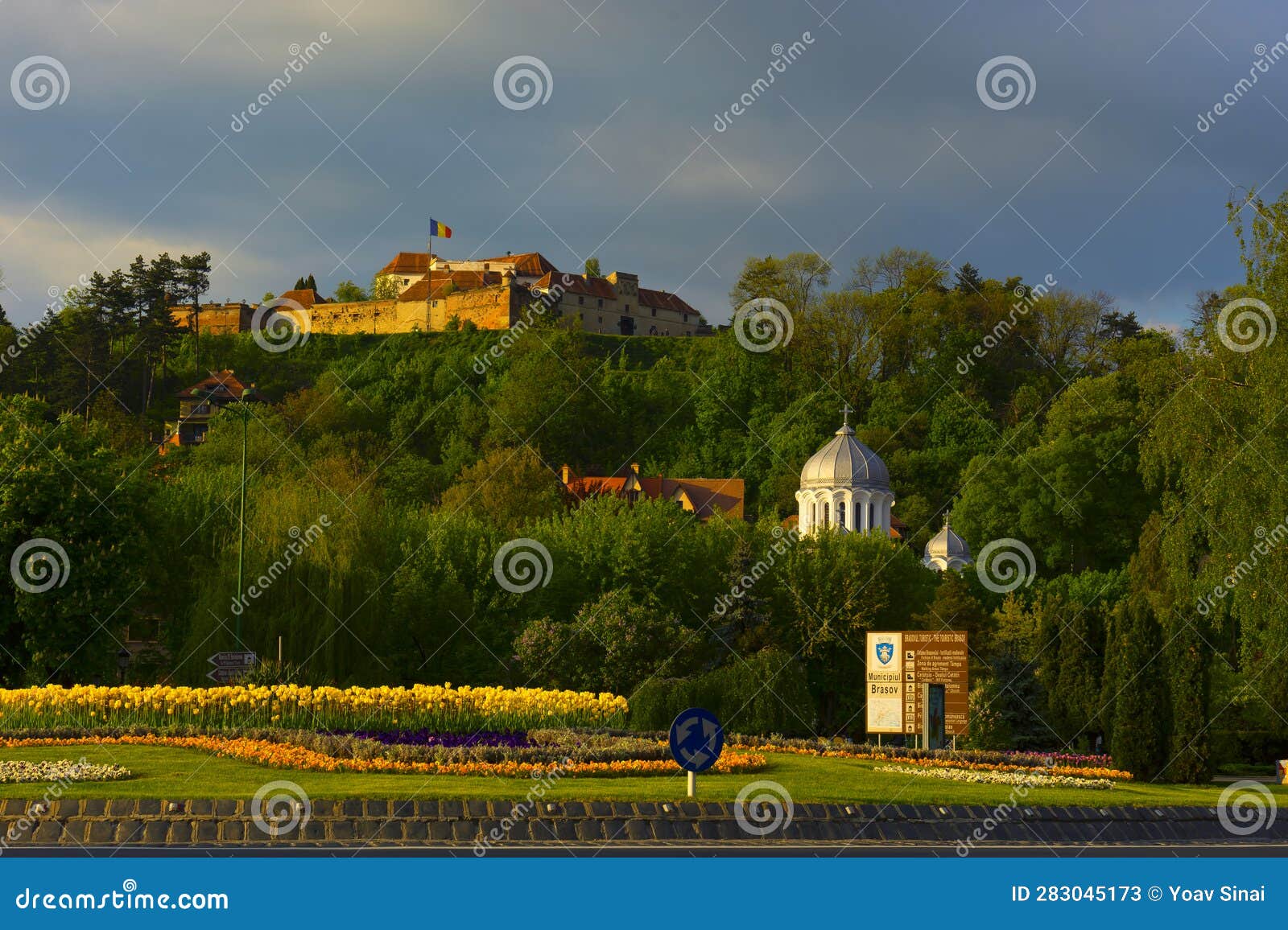 urban view of orthodox church and fortress in brasov in transylvania, rumania.