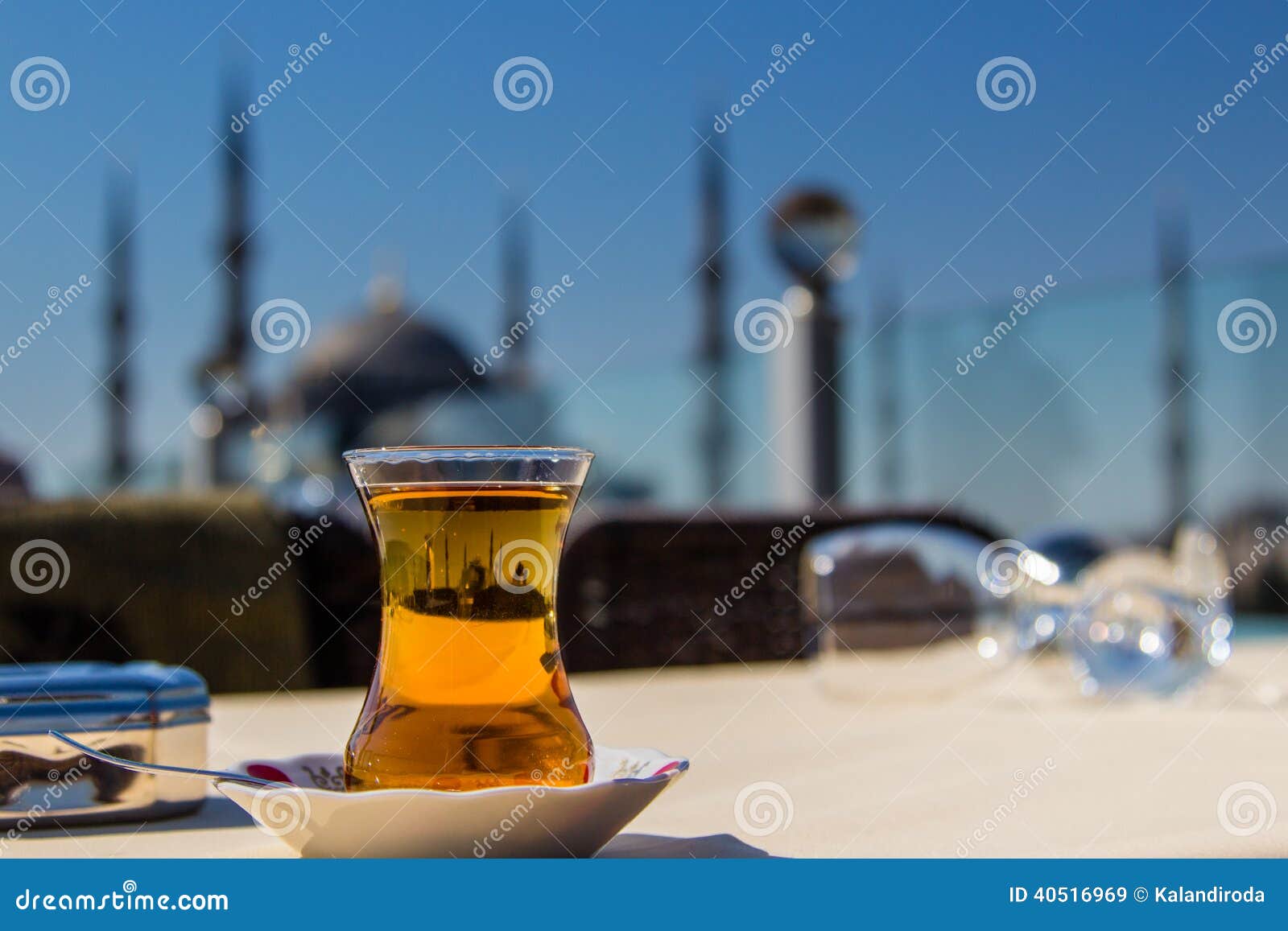 view of the blue mosque (sultanahmet camii) through a traditional turkish tea glass, istanbul, turkey