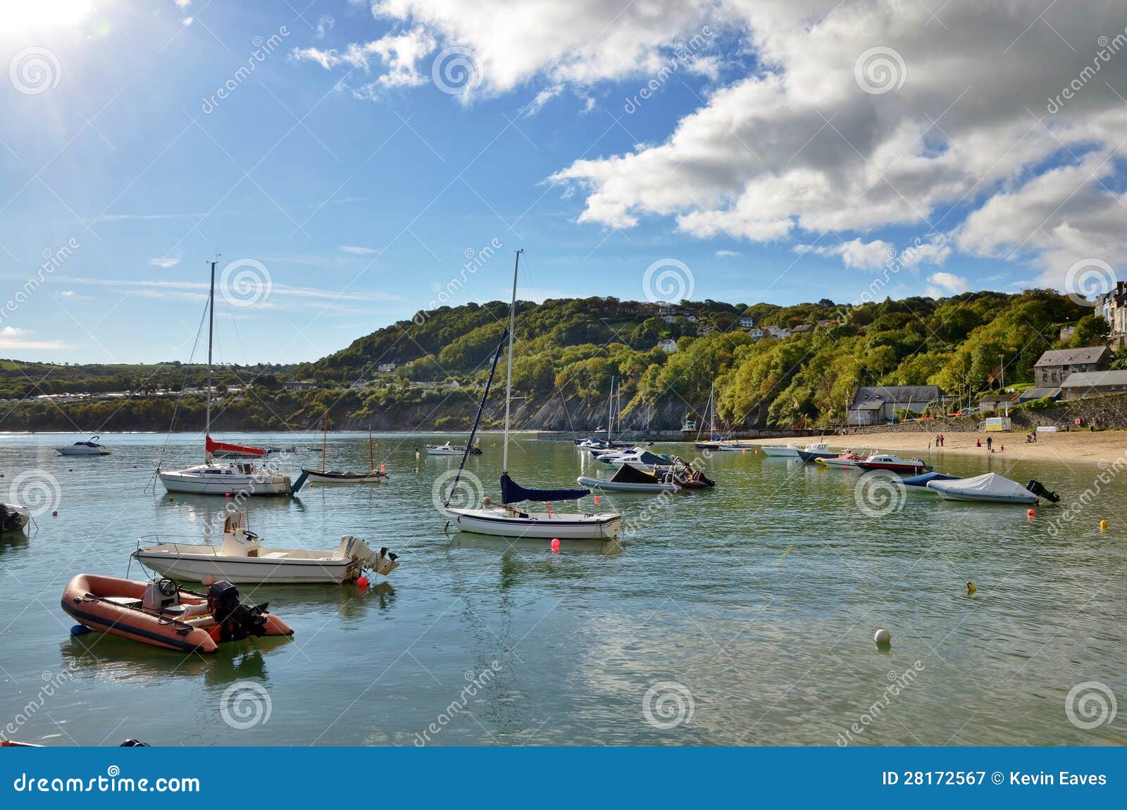view of boats in new quay harbour, wales.