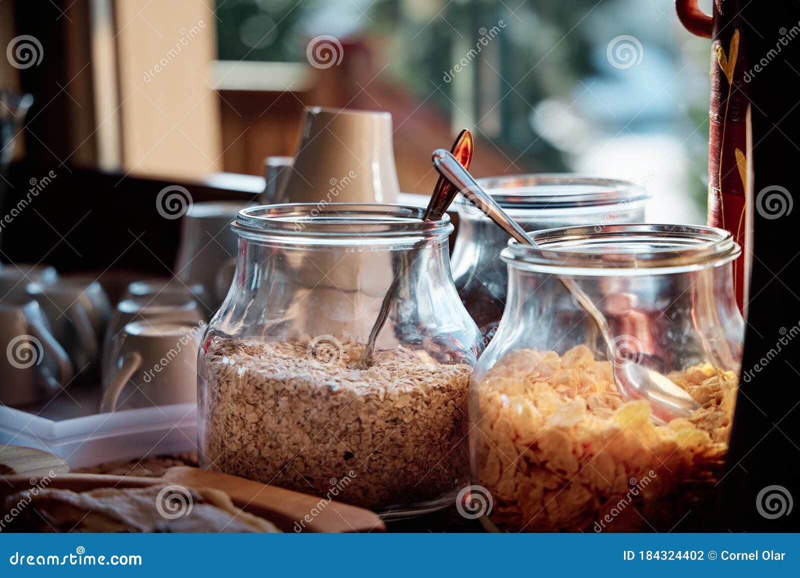A View of a Breakfast Buffet with Cereal in Jars in Front of a Window Stock  Photo - Image of delicious, corona: 184324402, image size:1600x1157
