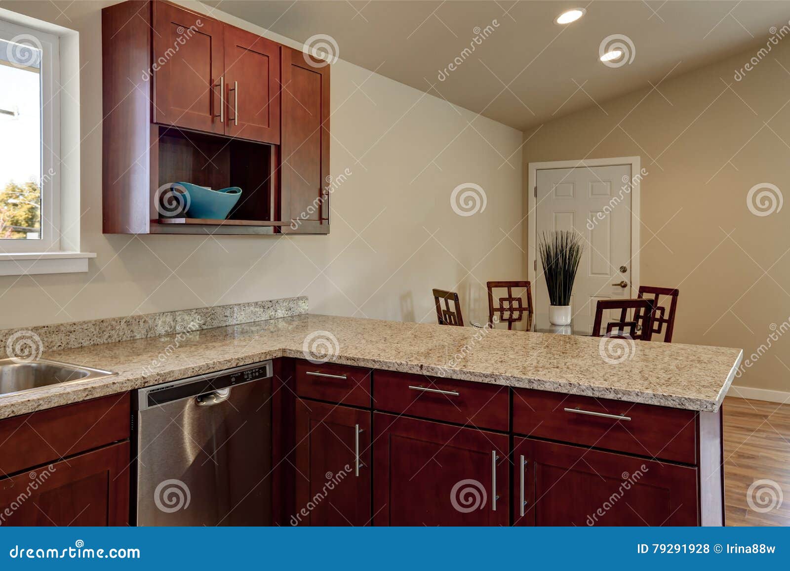 View Of Burgundy Kitchen Cabinets With Granite Counter Top Stock