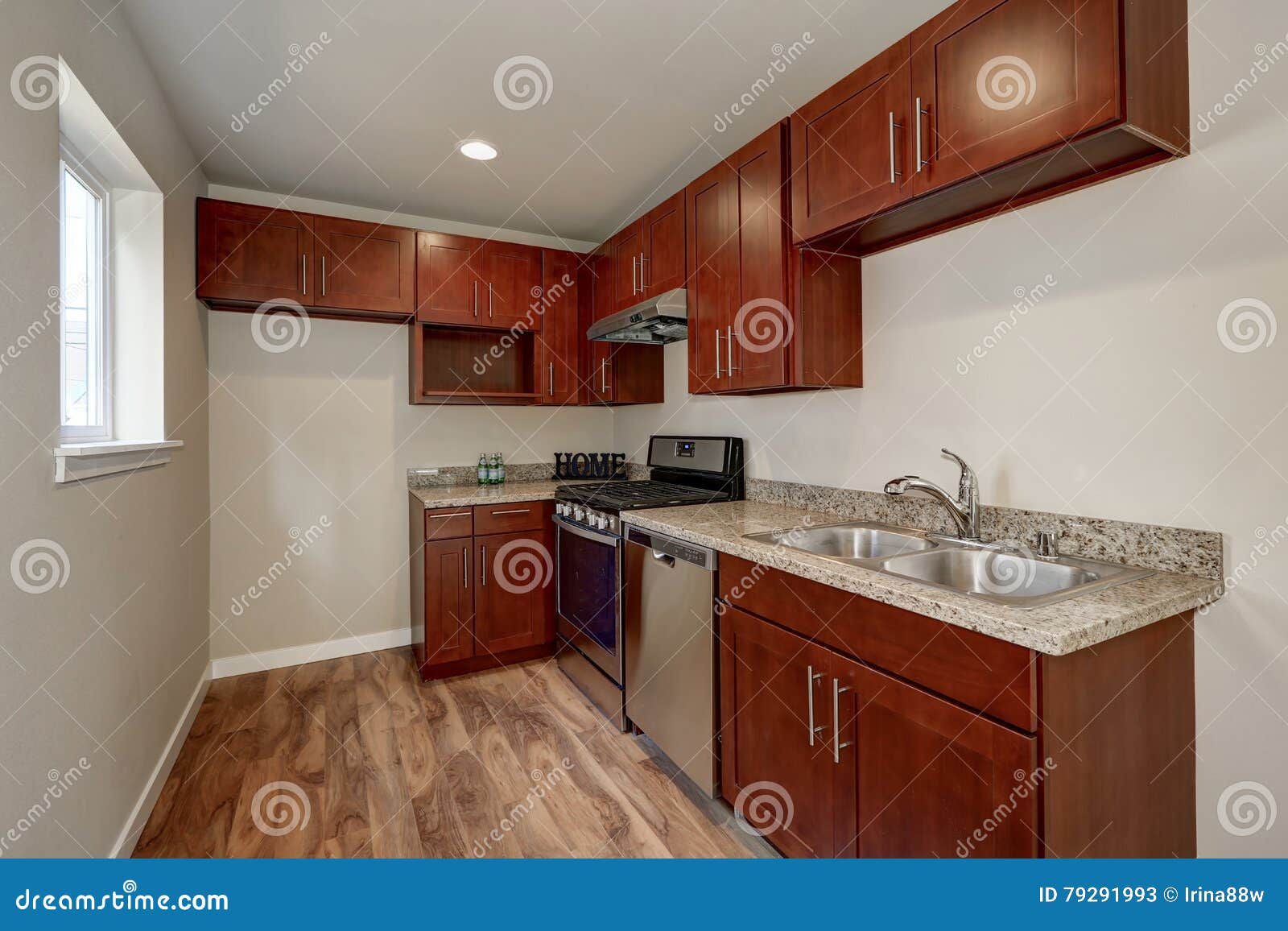 View Of Burgundy Kitchen Cabinets With Granite Counter Top Stock