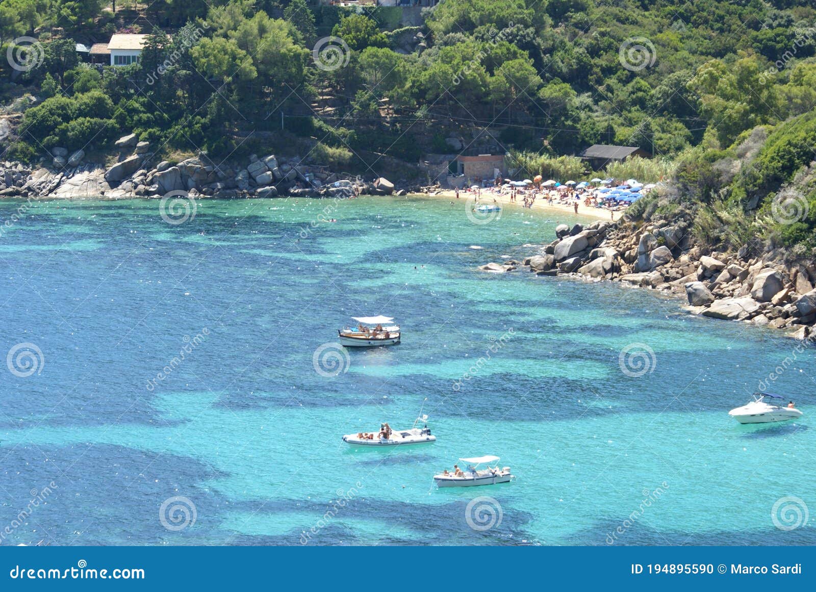 a view of caldane bay and beach in giglio island, italy