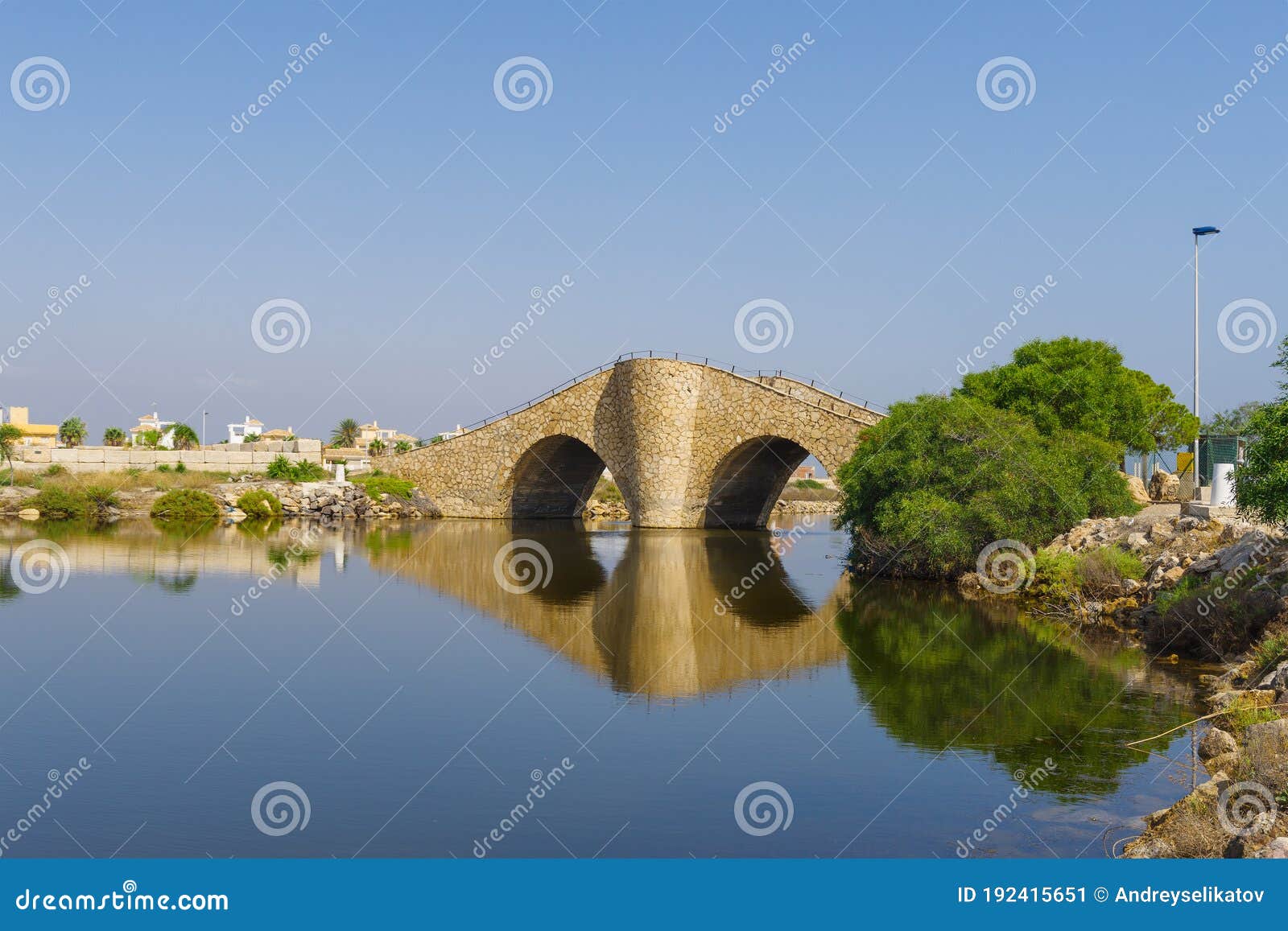 view on the canal in mar menor and an interesting arched bridge