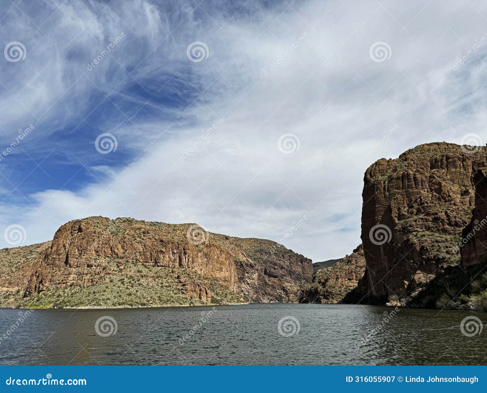 view of canyon lake and rock formations from a steamboat in arizona