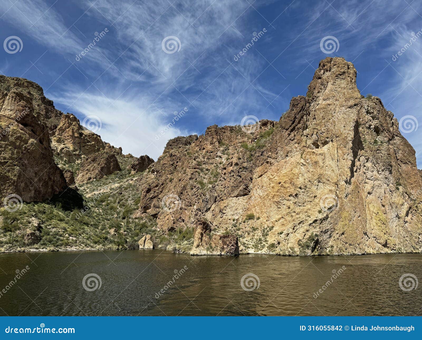 view of canyon lake and rock formations from a steamboat in arizona