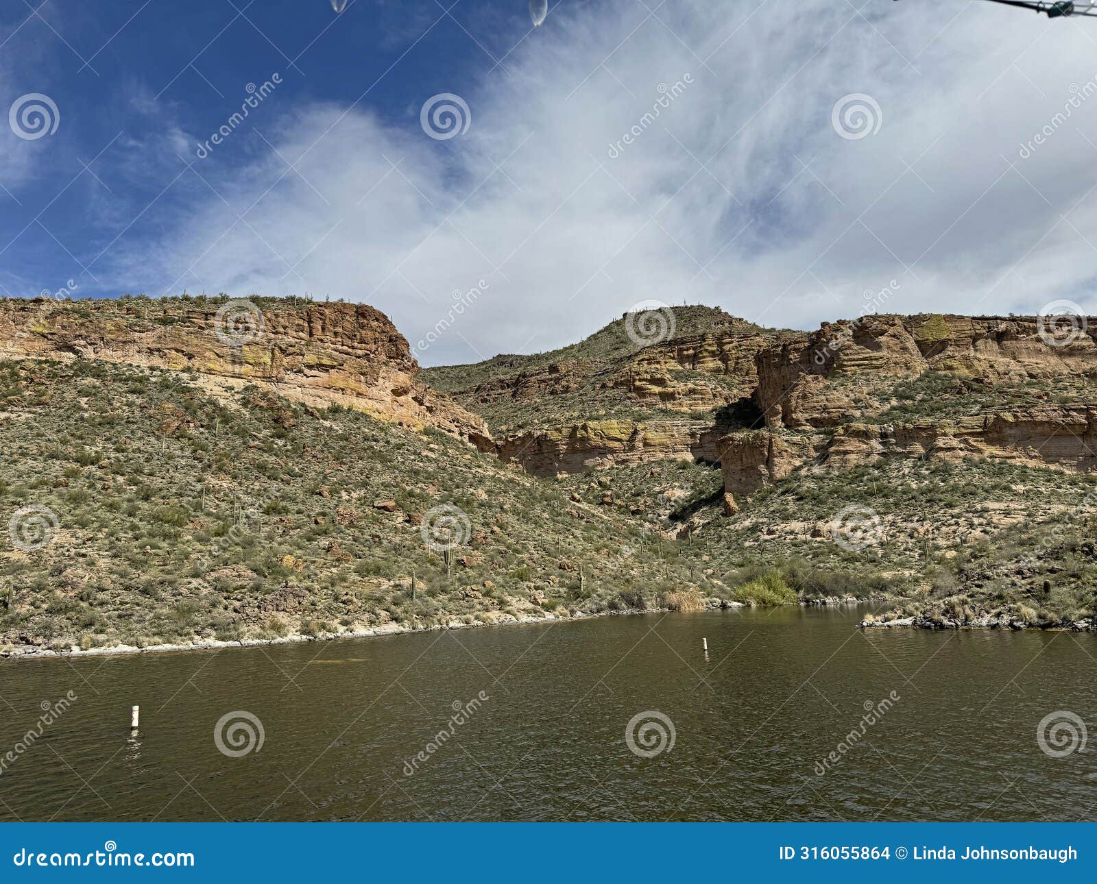 view of canyon lake and rock formations from a steamboat in arizona