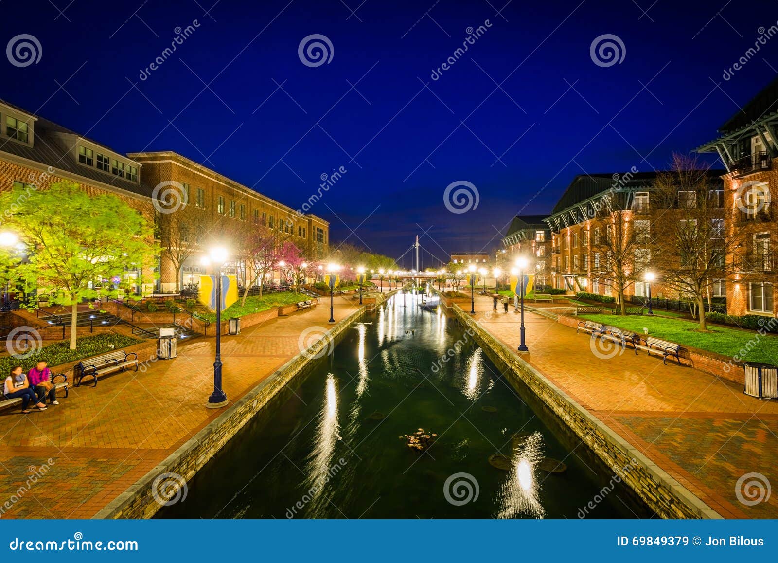 view of carroll creek at night, in frederick, maryland.