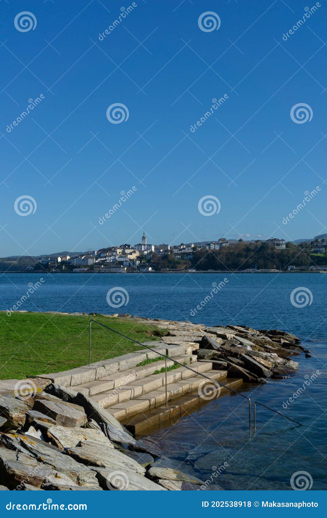 view of castropol in asturias across the ribadeo river with the praia dos bloques in the foreground
