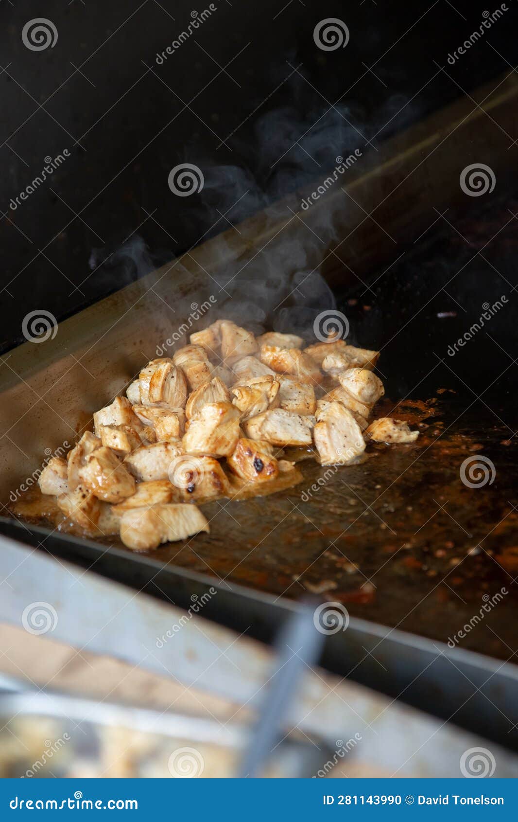 Chopped chicken on griddle stock photo. Image of grocery 281143990