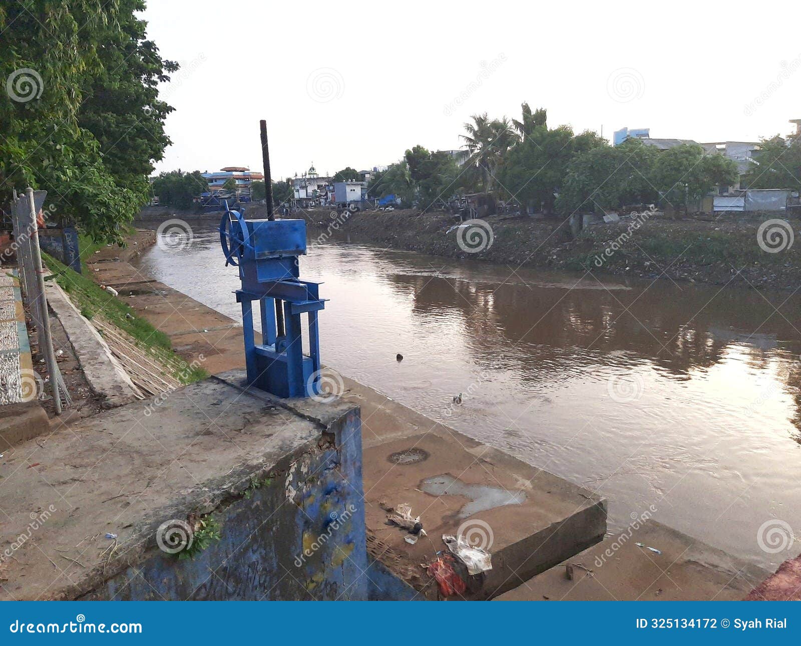 view of the ciliwung river embankment sluice gate in kampung melayu