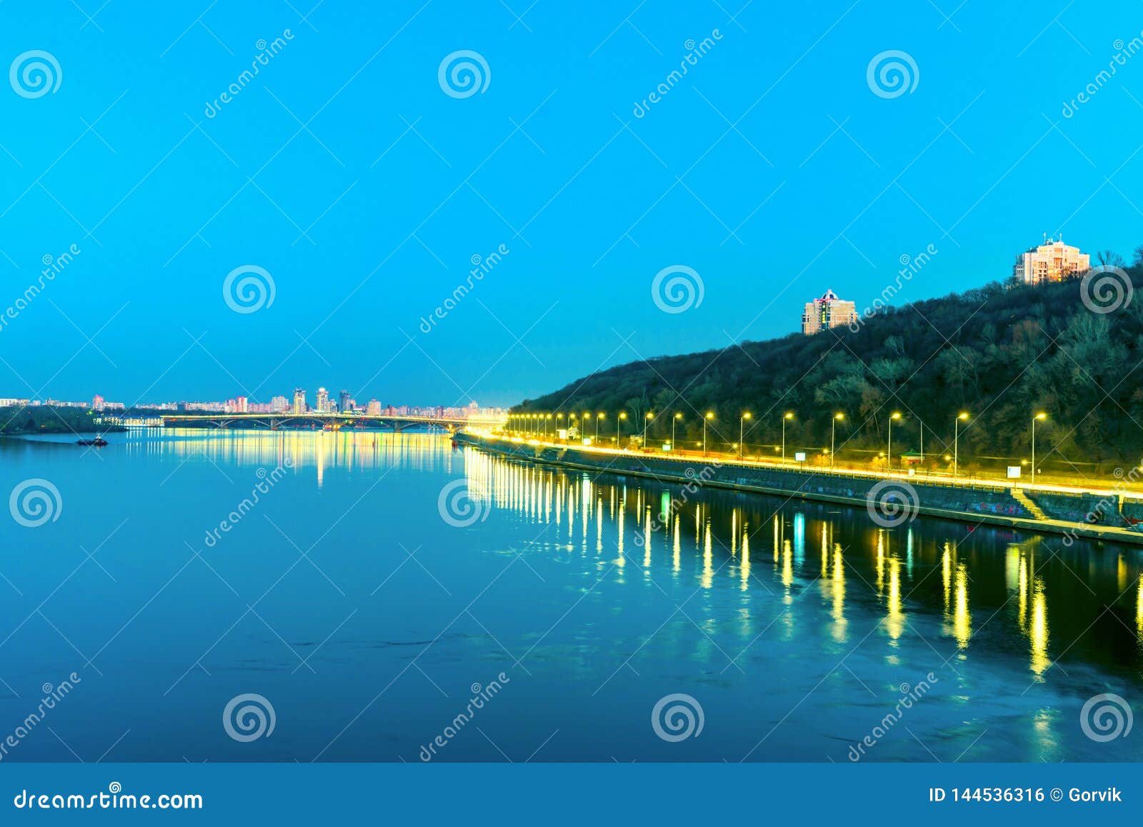 View of the City`s Waterfront in the Evening with Road Stock Photo