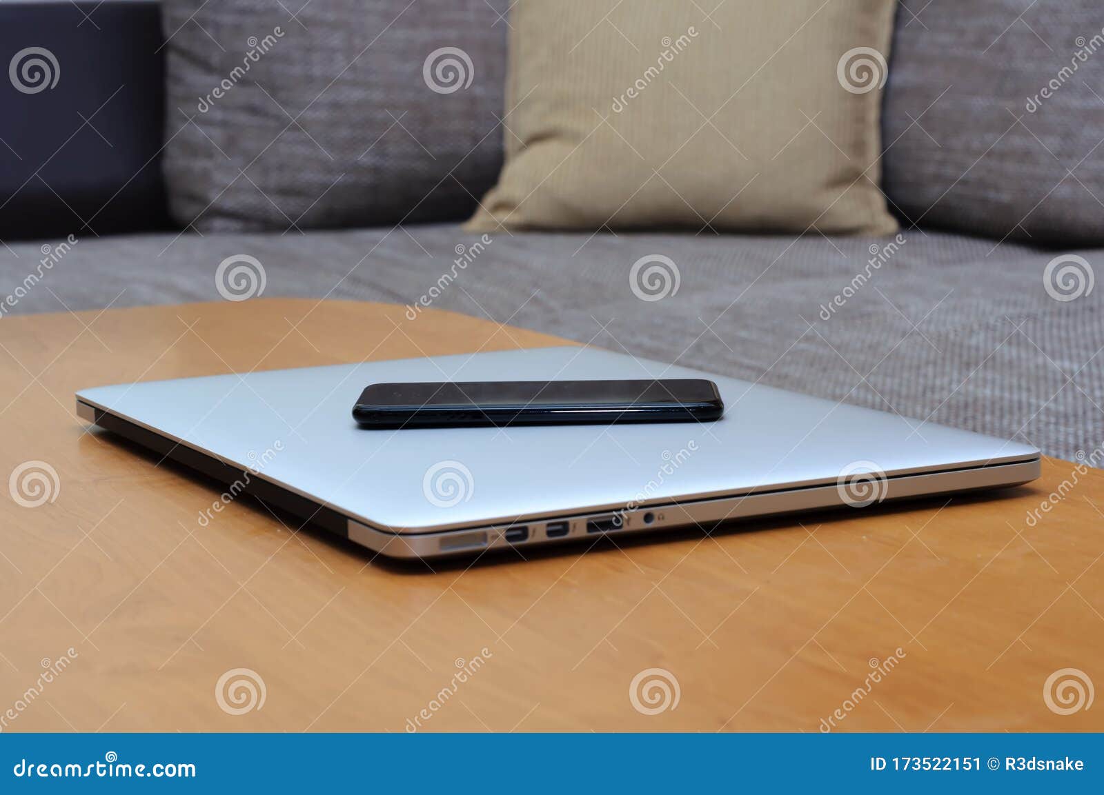 View On A Closed Laptop Pc On A Desk With A Smartphone In A Home