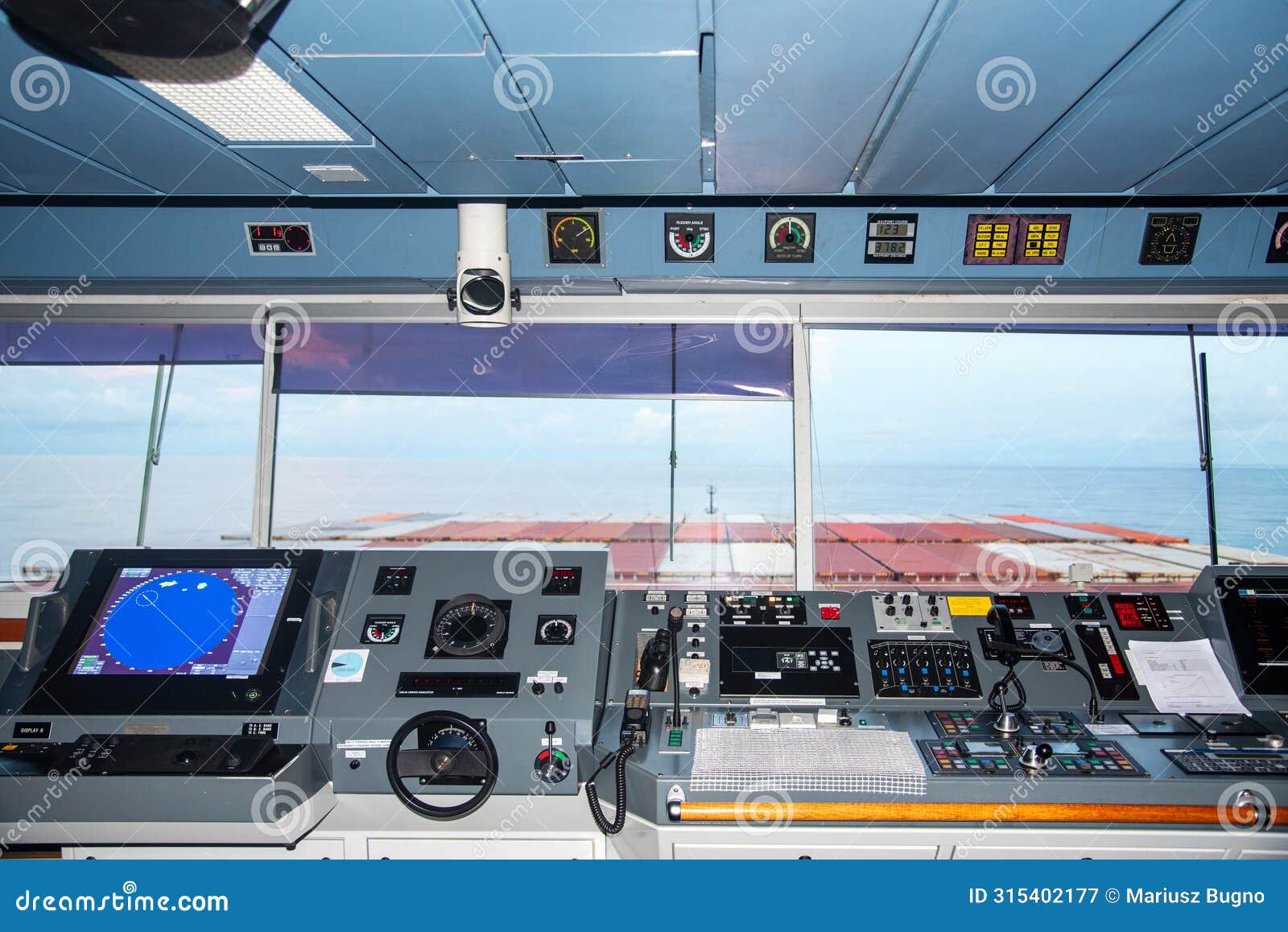 control console on the navigational bridge of the cargo container ship.