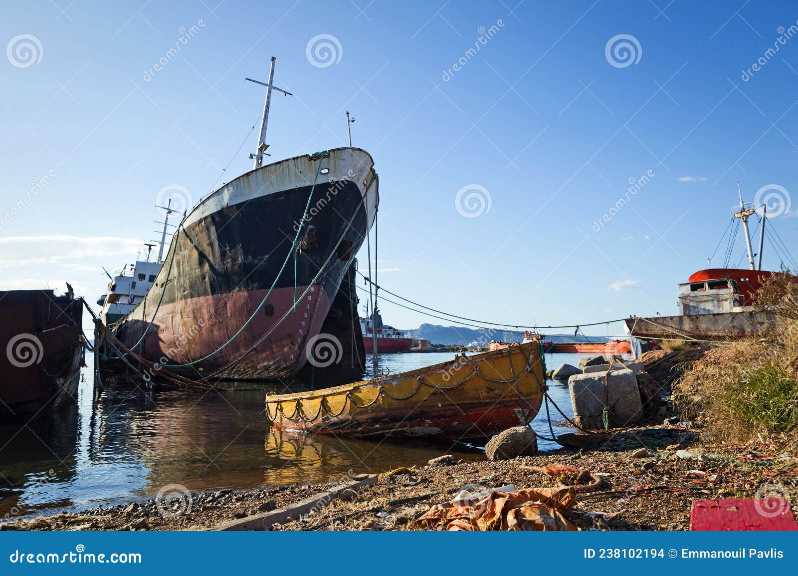 decommissioned ships in a dismantling yard