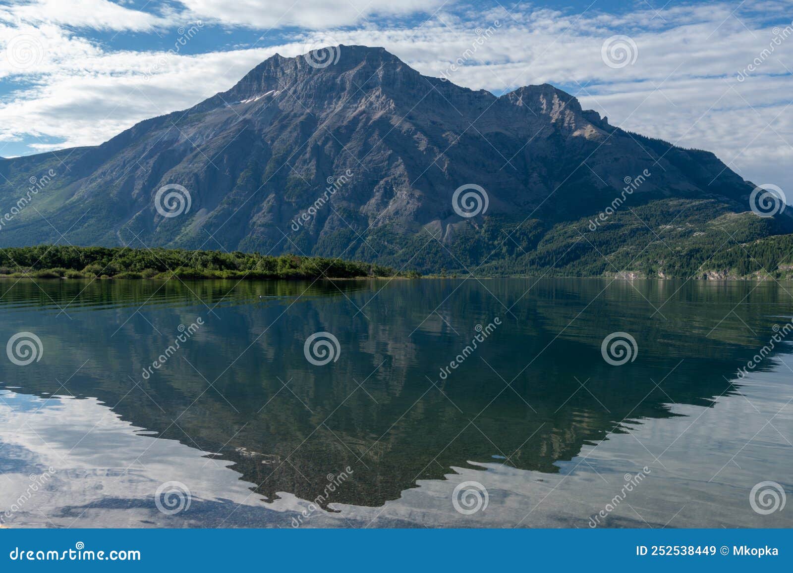 view from driftwood beach in waterton lakes national park in the canadian rockies