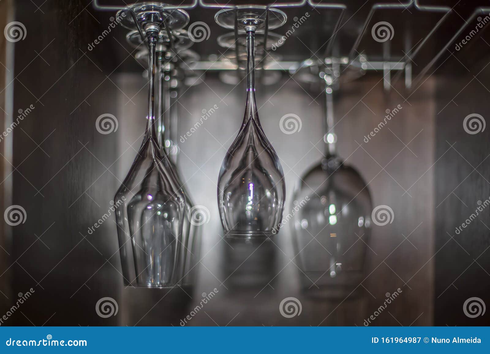 View with Empty Red Wine Transparent Glass Cups Stand Upside Down in
