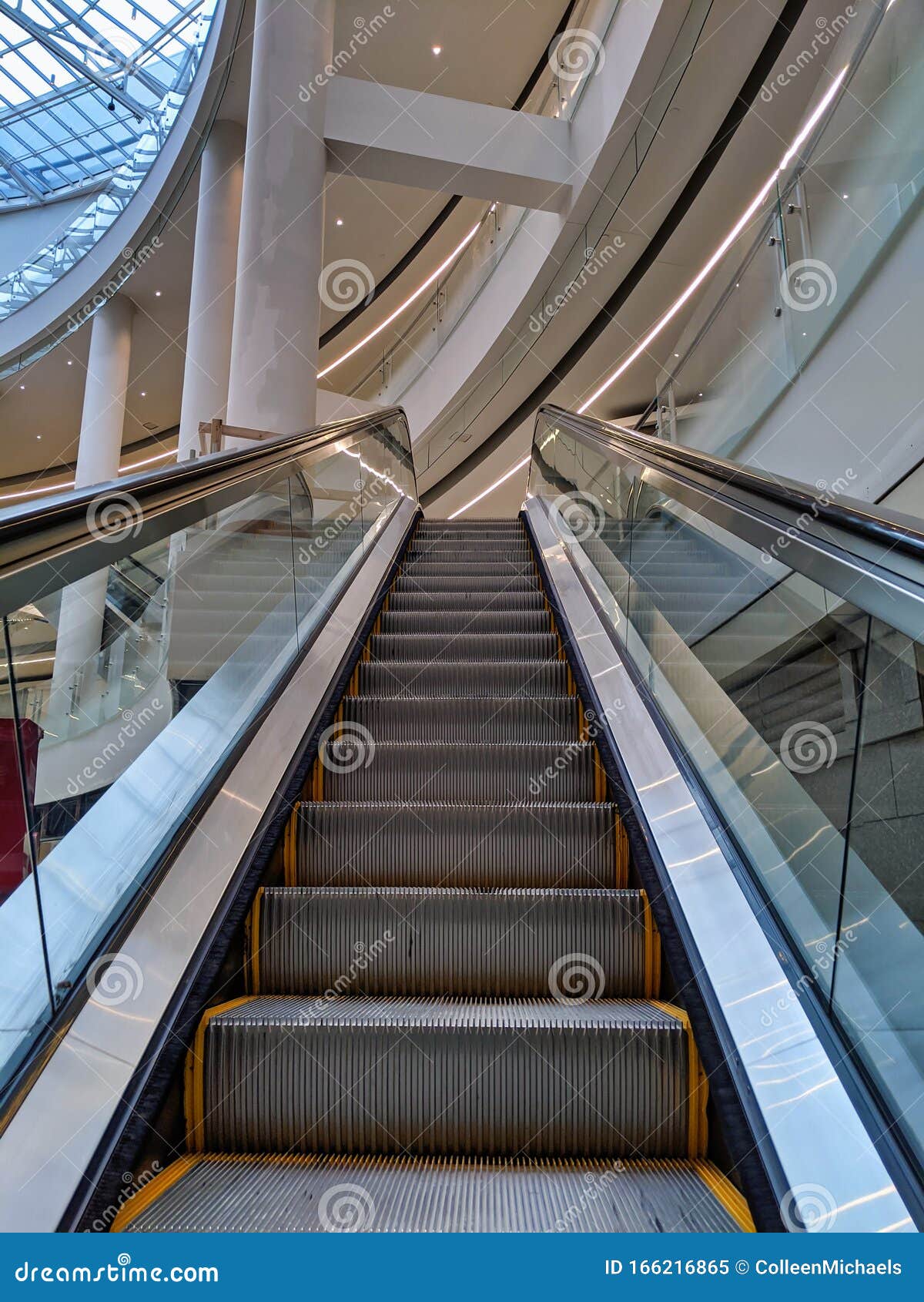 View of Escalator Steps Inside a Building, Leading Up To Another Level