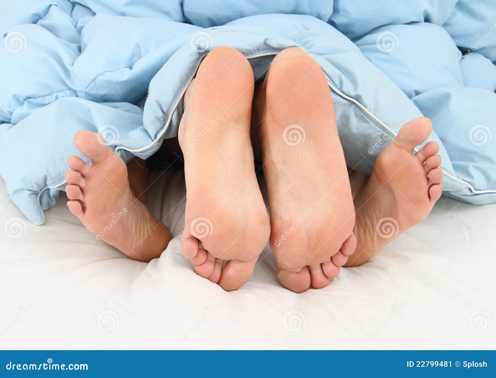 View Of Feet Of Couple Having Sex In Bed Stock Image