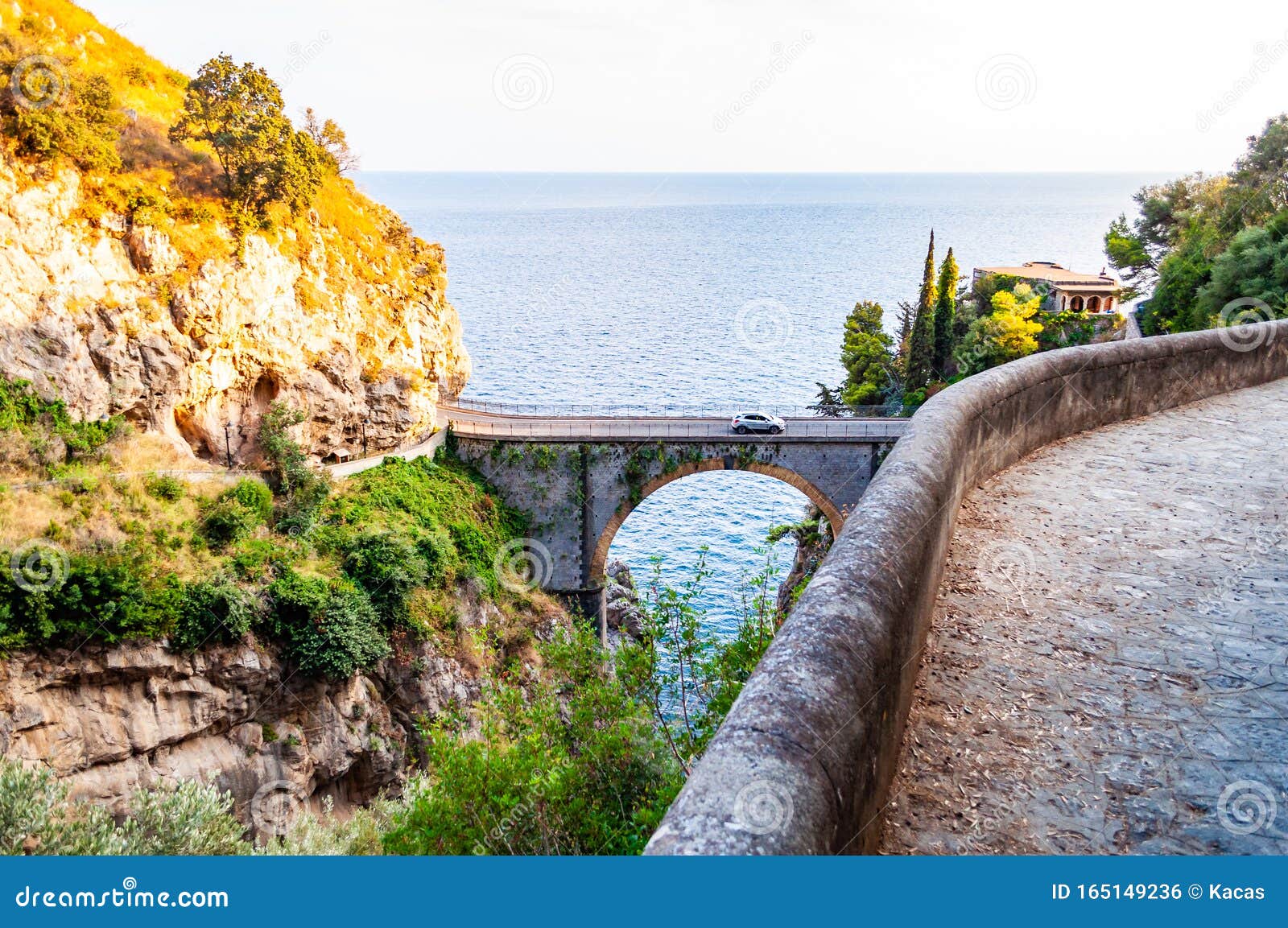 view on fiordo di furore arc bridge built between high rocky cliffs above the tyrrhenian sea bay in campania region. curved