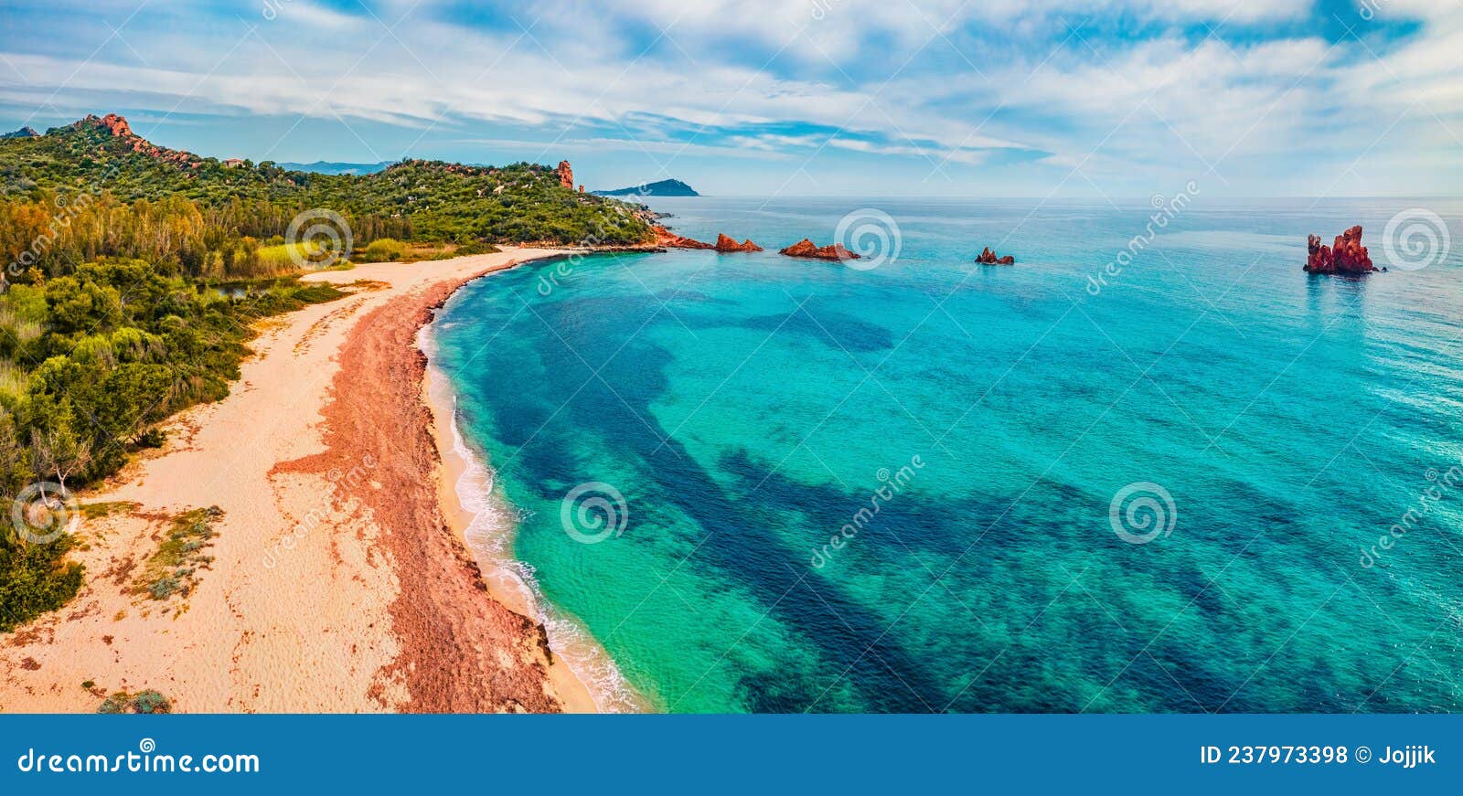 view from flying drone. captivating summer view of di cea beach with red rocks gli scogli rossi - faraglioni. aerial morning scene