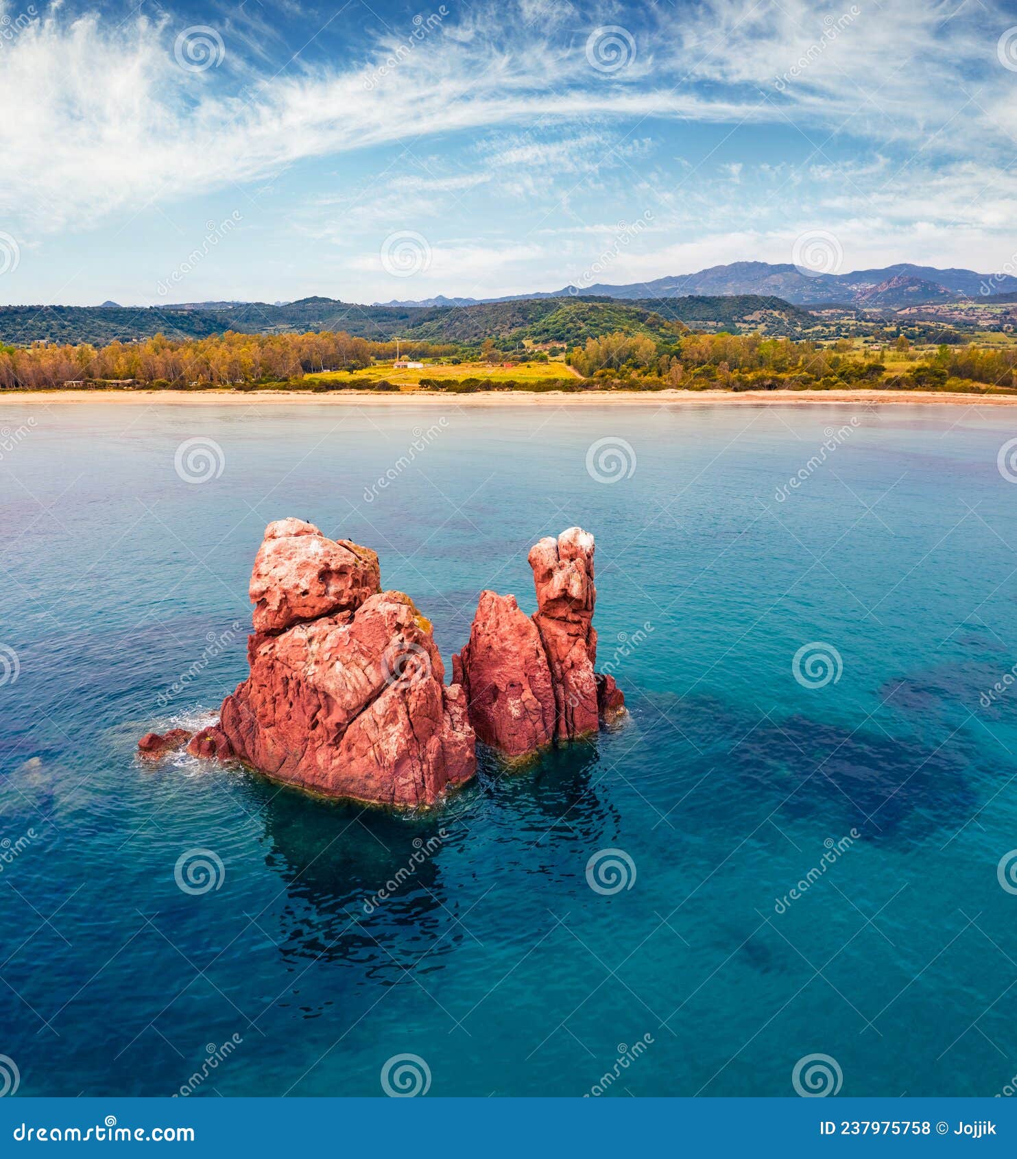 view from flying drone. gorgeous summer view of di cea beach with red rocks gli scogli rossi - faraglioni.