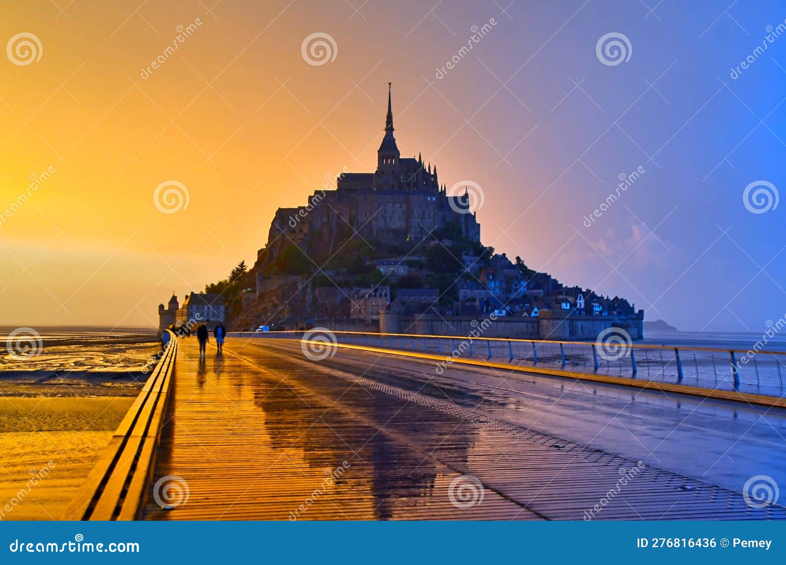 view of mont saint-michel in the light of sunset