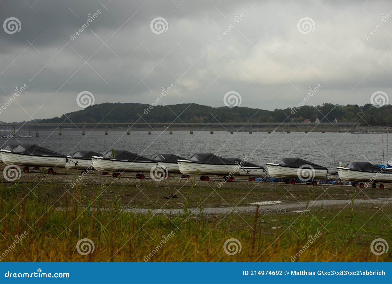 view from the german lake called moehnesee with tiny boats