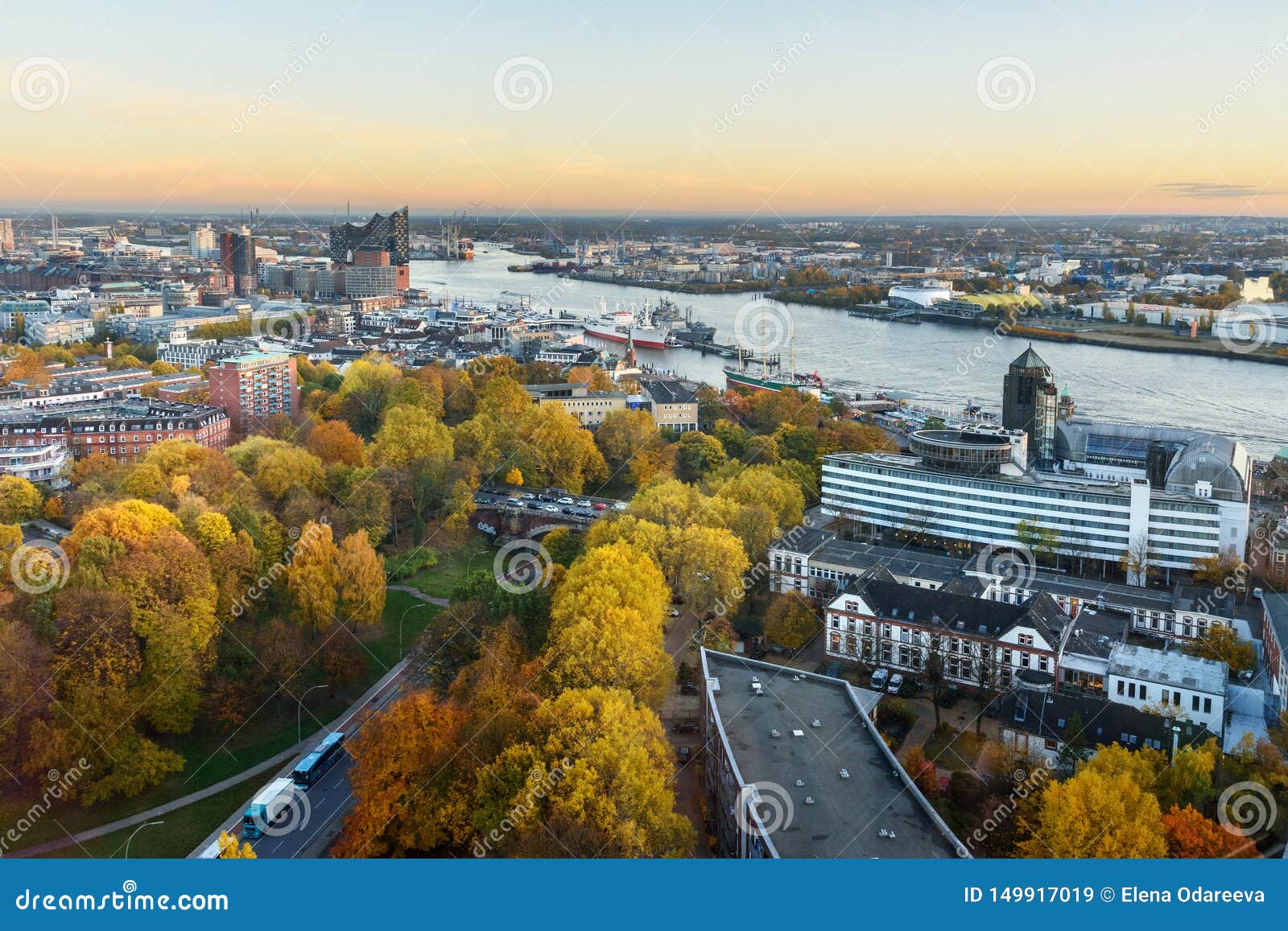 view of hamburg with michel, harbor, and new elbphilharmony on sunset. germany