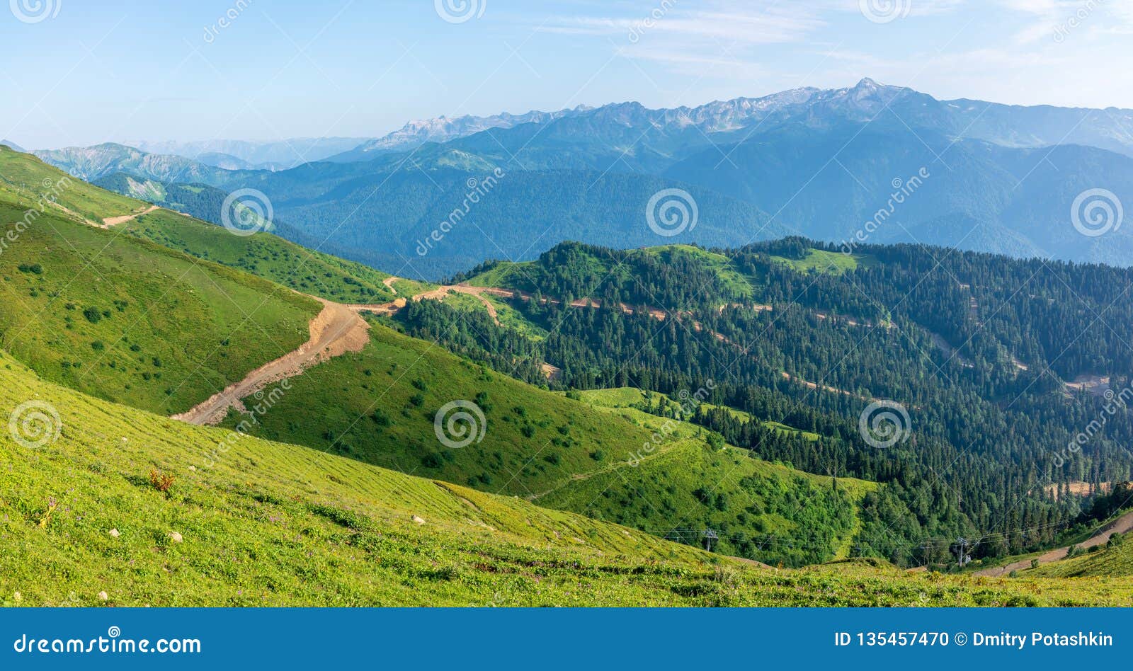 The View From The Height Of A Green Mountain Valley With Residential